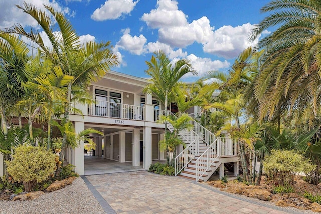 17346 Keystone Rd, Sugarloaf, FL 33042 - beach home with a carport, a porch, driveway, and stairway