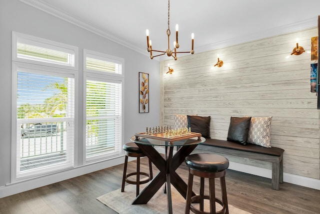 17346 Keystone Rd, Sugarloaf, FL 33042 - dining room featuring an inviting chandelier, wooden walls, wood finished floors, ornamental molding, and baseboards