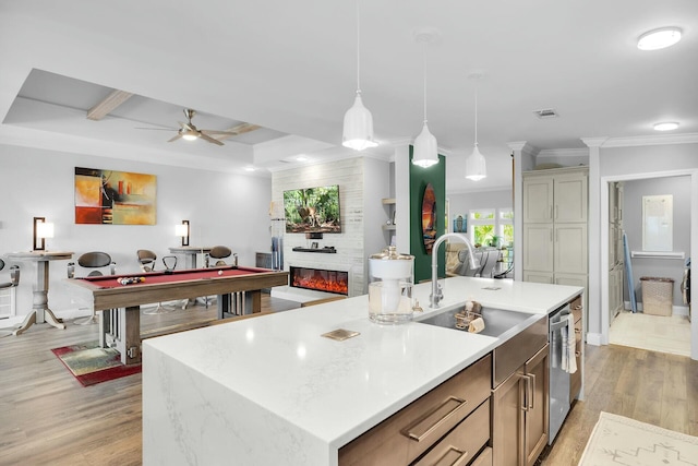 17346 Keystone Rd, Sugarloaf, FL 33042 - kitchen with stainless steel dishwasher, a ceiling fan, crown molding, light wood-style floors, and light countertops