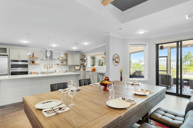 17346 Keystone Rd, Sugarloaf, FL 33042 - dining space featuring visible vents, recessed lighting, light wood-style floors, and crown molding