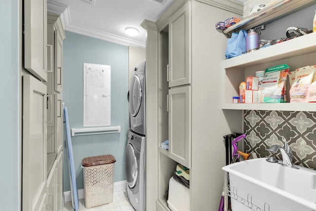17346 Keystone Rd, Sugarloaf, FL 33042 - washroom featuring stacked washer / drying machine, a sink, electric panel, crown molding, and cabinet space