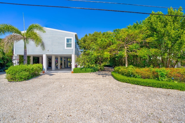 exterior space featuring a carport and driveway