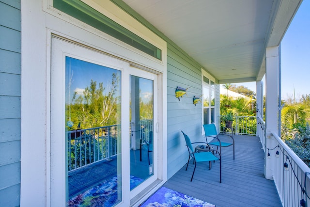 wooden deck featuring covered porch