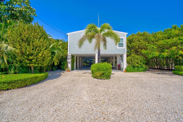 beach home with a carport and driveway