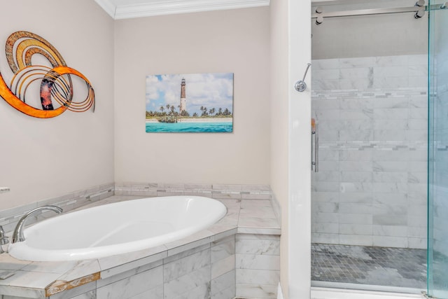 bathroom featuring a garden tub, a stall shower, and ornamental molding