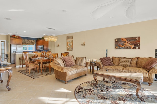 living room featuring light tile patterned flooring and crown molding