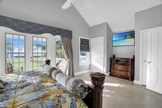 tiled bedroom with french doors, high vaulted ceiling, and access to outside