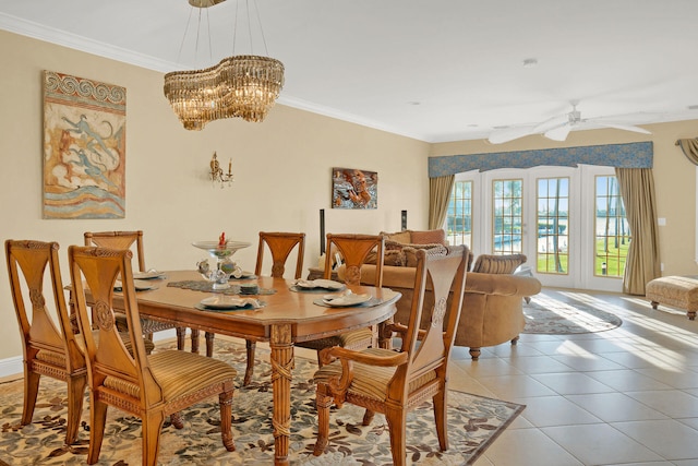 tiled dining room featuring crown molding and ceiling fan with notable chandelier