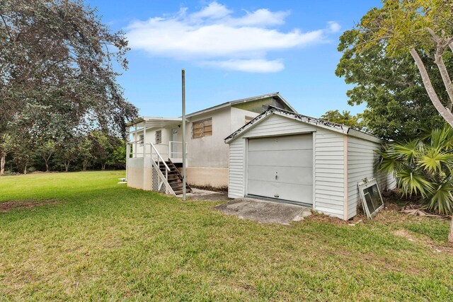 exterior space featuring a yard and a garage