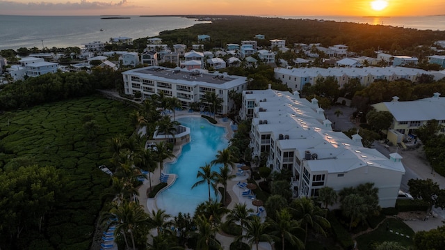 aerial view at dusk with a water view