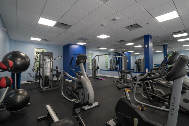 gym featuring a paneled ceiling