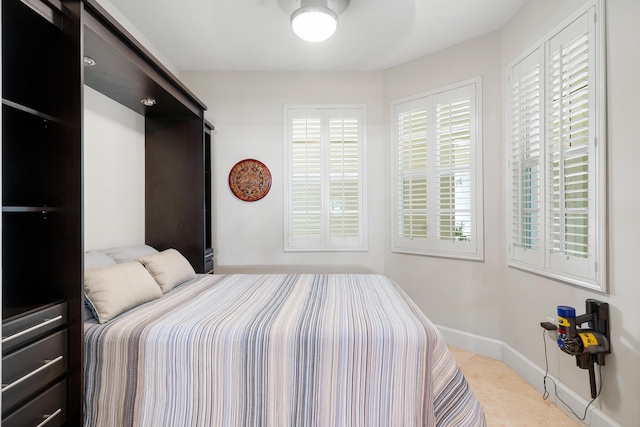 bedroom featuring multiple windows