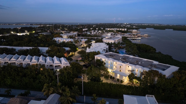 aerial view at dusk with a water view