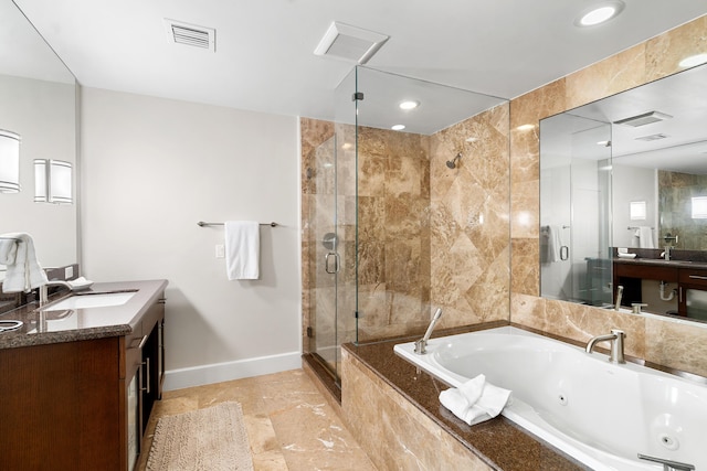 bathroom with plus walk in shower and vanity