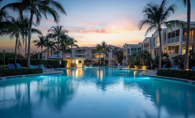 view of pool at dusk