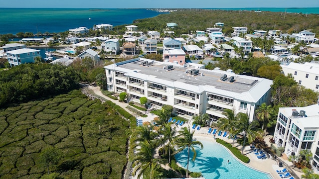 birds eye view of property with a water view