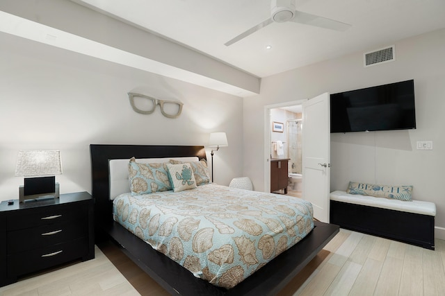 bedroom featuring ceiling fan, ensuite bathroom, and light hardwood / wood-style floors