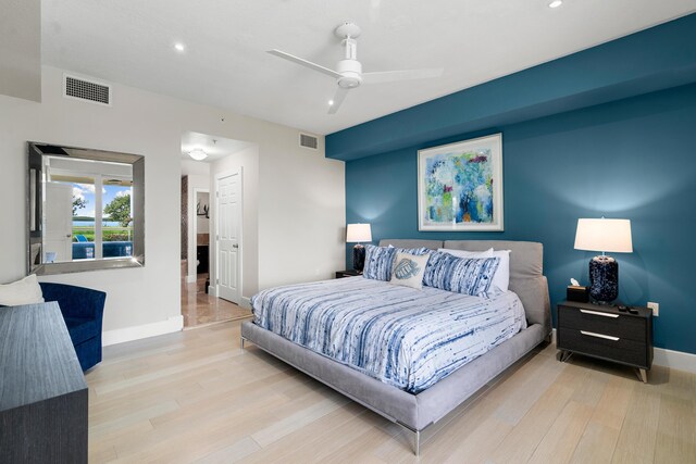 bedroom featuring ceiling fan and light hardwood / wood-style floors