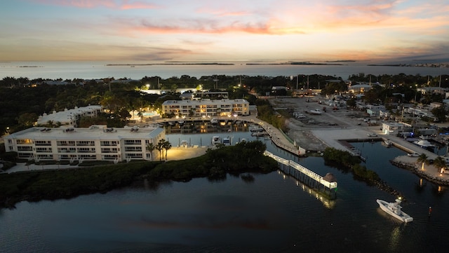 aerial view at dusk with a water view