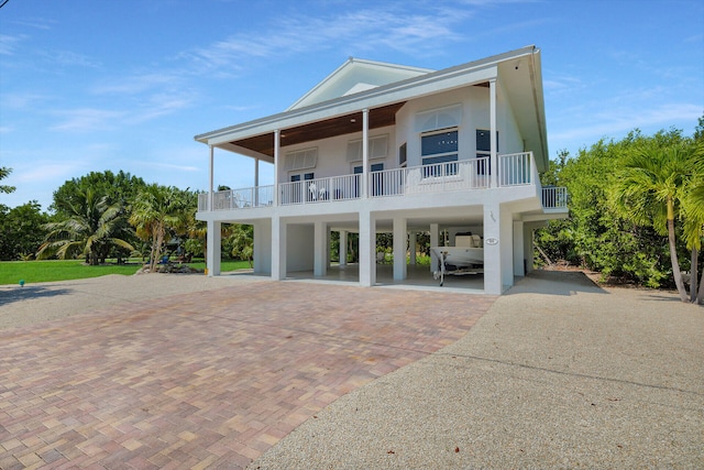 exterior space with a carport and a balcony