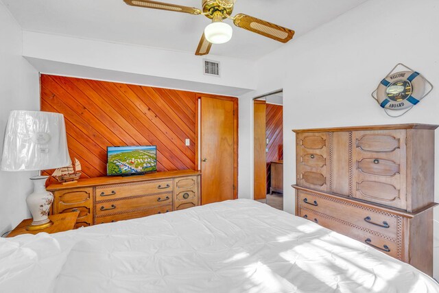 bedroom with light colored carpet, a closet, and ceiling fan