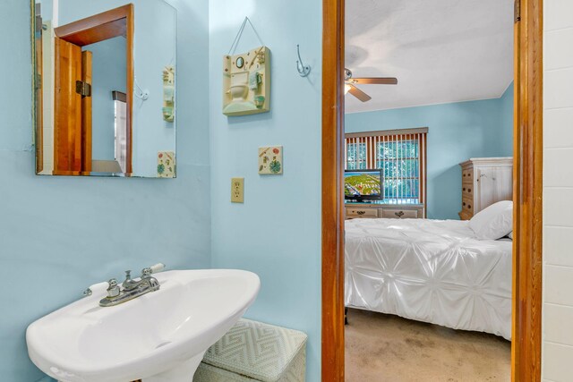 bathroom with ceiling fan and sink