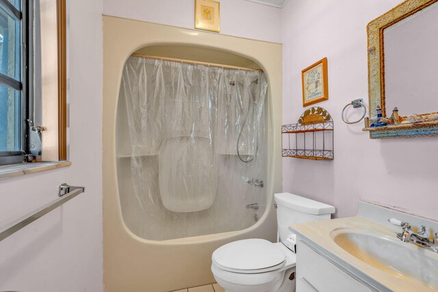 full bathroom with vanity, shower / bath combination with curtain, and toilet