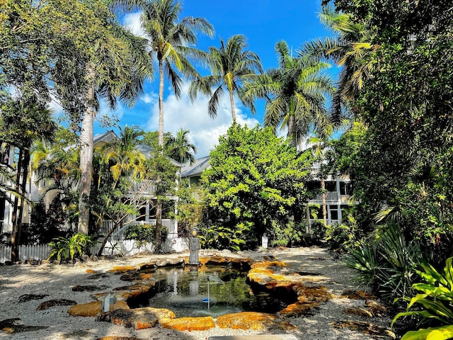 48 Merganser Ln, Key West, FL 33040 - view of yard featuring a garden pond and a balcony