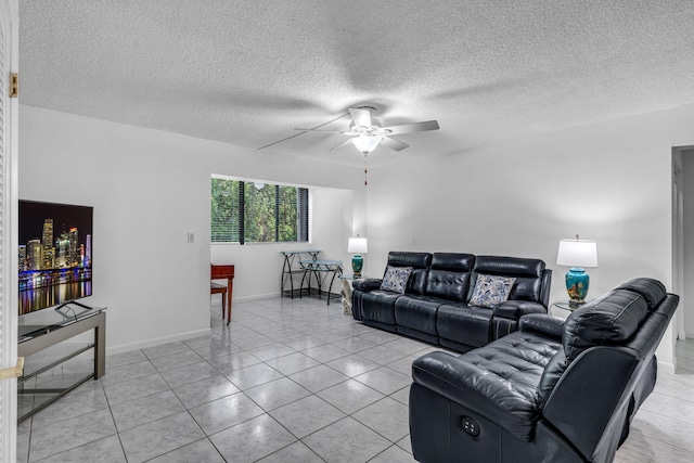 tiled living room featuring ceiling fan and a textured ceiling