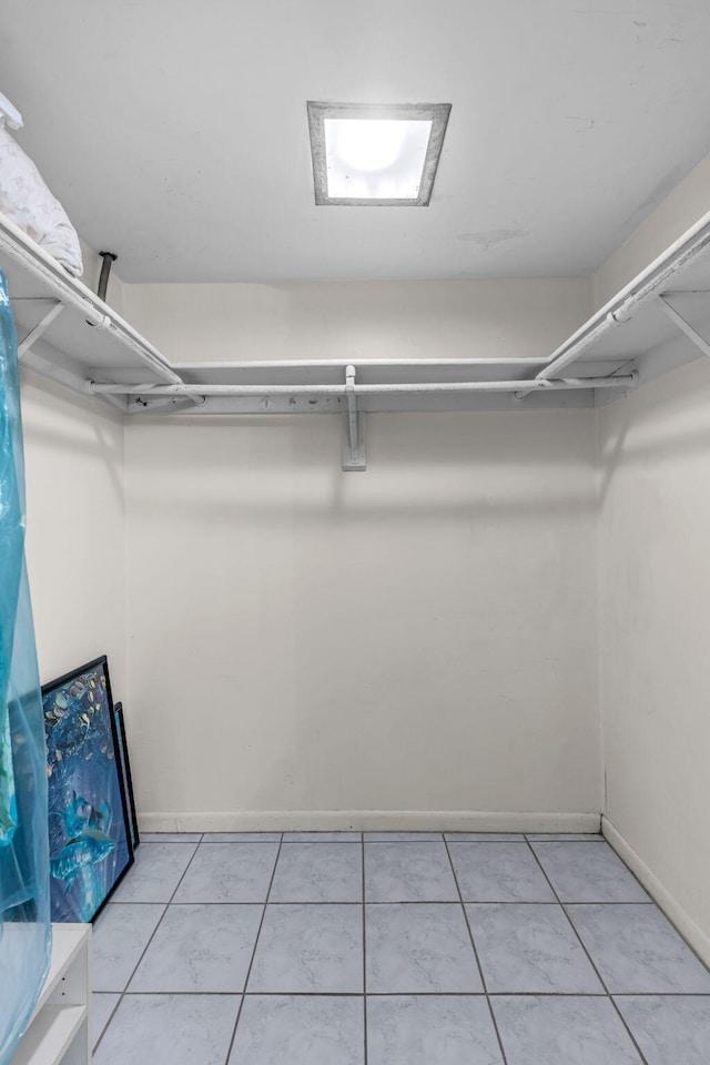 walk in closet featuring light tile patterned floors