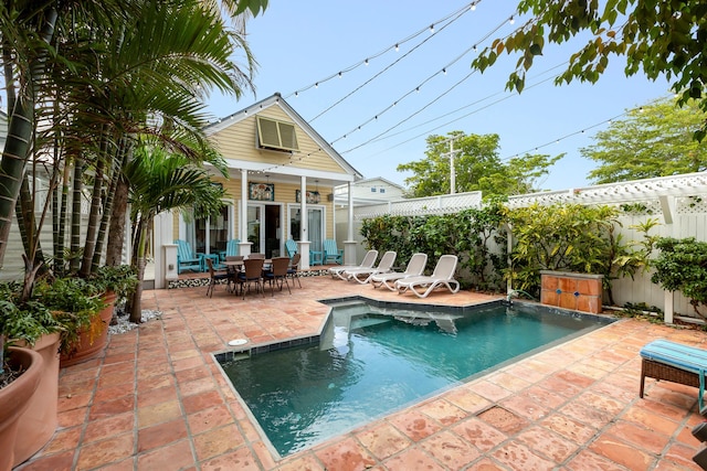 view of swimming pool with an outbuilding and a patio area