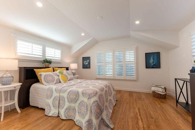 bedroom with recessed lighting, baseboards, wood finished floors, and vaulted ceiling