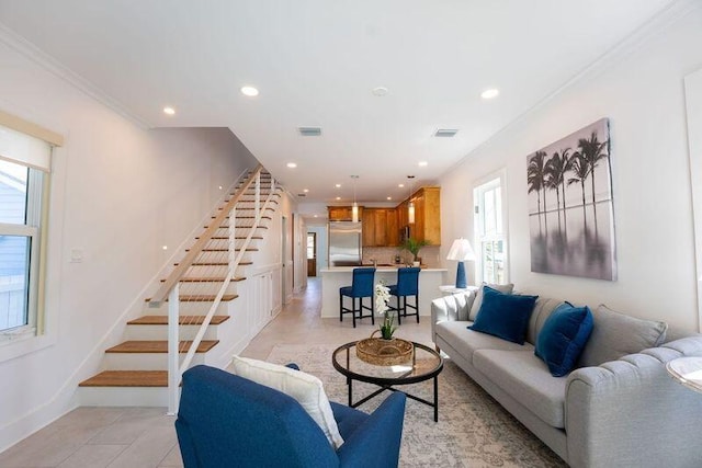 living area with stairway, light tile patterned floors, visible vents, recessed lighting, and ornamental molding