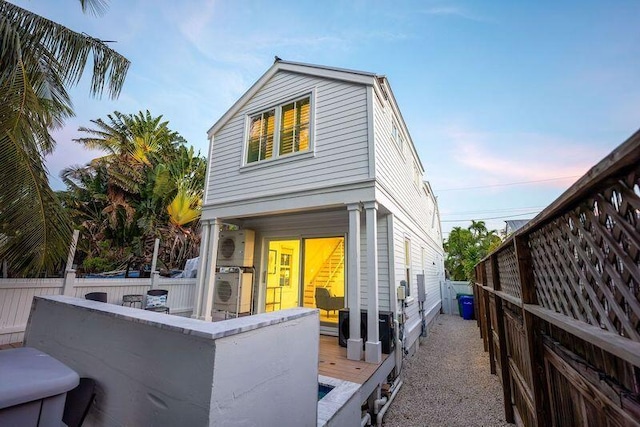 view of front of house with a deck and a fenced backyard