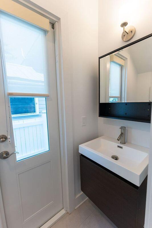 bathroom with tile patterned floors and vanity