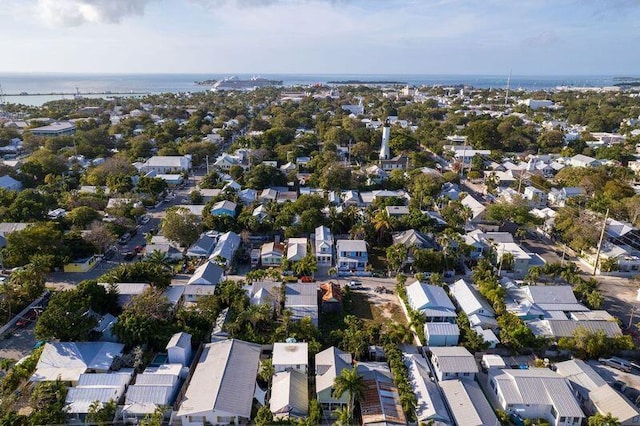 drone / aerial view featuring a water view and a residential view