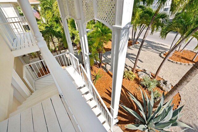 raised beach house featuring a garage