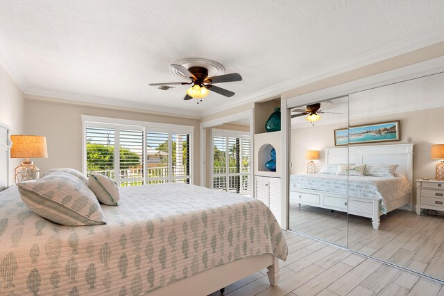 bedroom with crown molding, ceiling fan, a textured ceiling, and access to outside