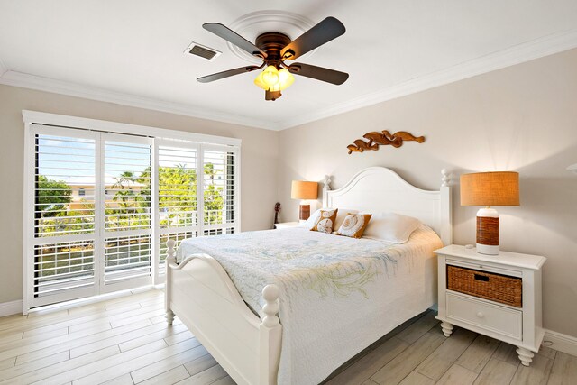 bedroom with ceiling fan and ornamental molding