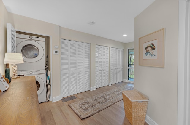 18 Anchor Dr Unit B, Key Largo, FL 33037 - clothes washing area featuring baseboards, stacked washer / dryer, recessed lighting, wood finished floors, and laundry area