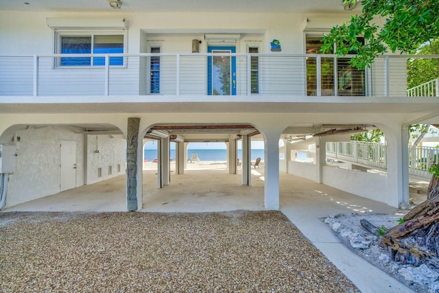 view of vehicle parking featuring a water view