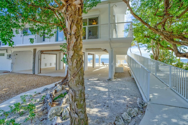 exterior space featuring a water view and a balcony