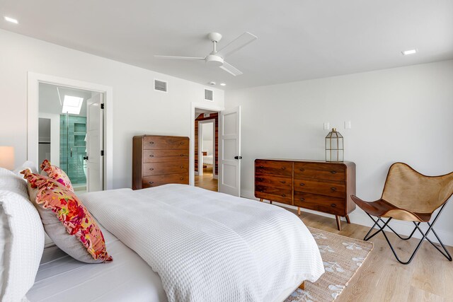 1114 Grinnell St, Key West, FL 33040 - bedroom with light wood-type flooring, ceiling fan, and connected bathroom