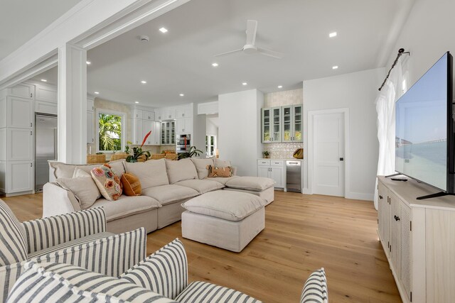 1114 Grinnell St, Key West, FL 33040 - living area with light wood finished floors, a ceiling fan, a bar, and recessed lighting