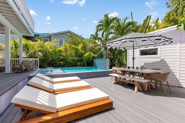 1114 Grinnell St, Key West, FL 33040 - wooden terrace featuring outdoor dining space and an outdoor pool