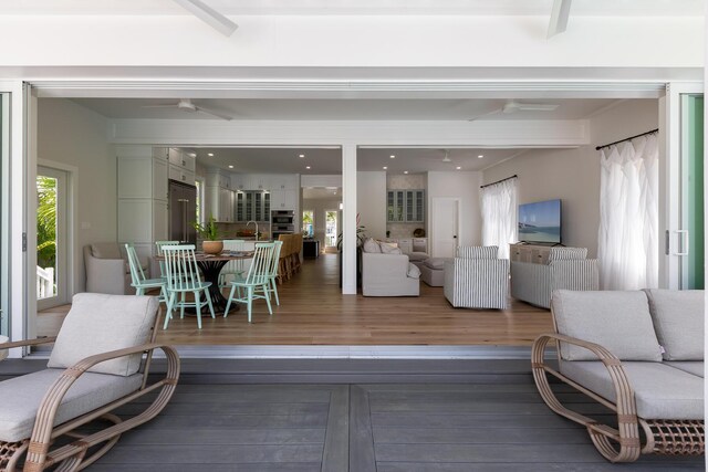 1114 Grinnell St, Key West, FL 33040 - living area with a ceiling fan, wood finished floors, and plenty of natural light