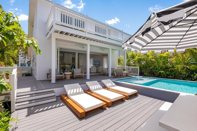 1114 Grinnell St, Key West, FL 33040 - rear view of property with a balcony, an outdoor pool, and a deck