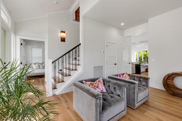 1114 Grinnell St, Key West, FL 33040 - living room with ornamental molding, light wood-style floors, stairway, and recessed lighting