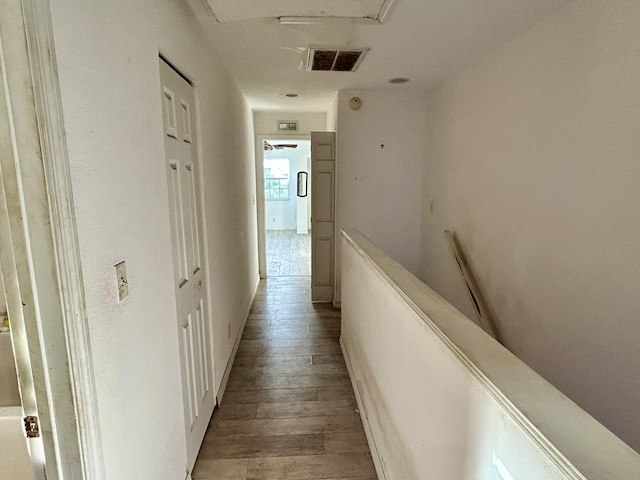 hall with light hardwood / wood-style flooring