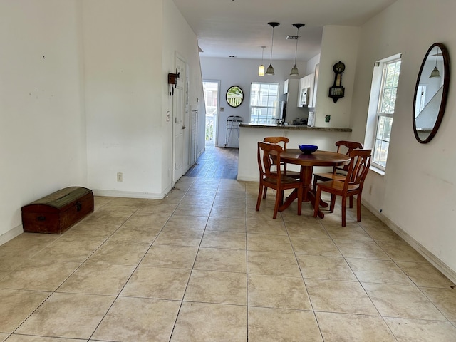 dining room featuring light tile patterned flooring